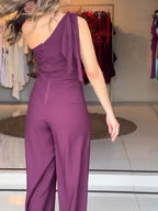 Purple one-shoulder jumpsuit with twisted drape bodice and wide legs