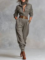 Gray-brown cotton-linen jumpsuit with long sleeves, button front, and chest pockets