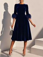 Dark blue velvet midi A-line dress with round neck and feather-trimmed sleeves