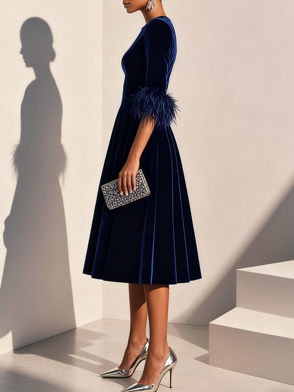 Dark blue velvet midi A-line dress with feather-trimmed short sleeves, side view