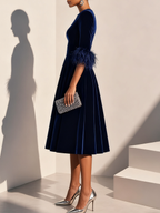 Dark blue velvet midi A-line dress with feather-trimmed short sleeves, side view