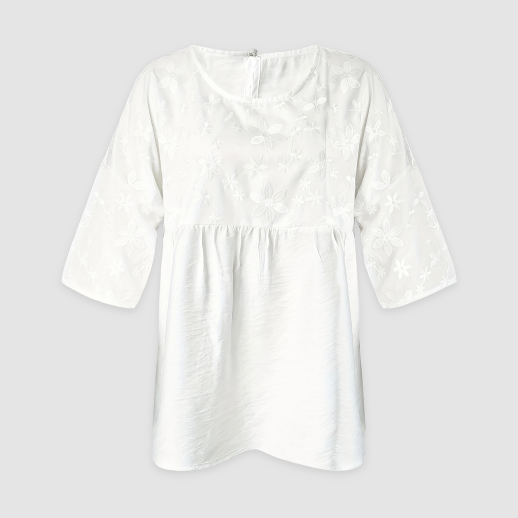 White loose-fit shirt with allover floral pattern and long sleeves