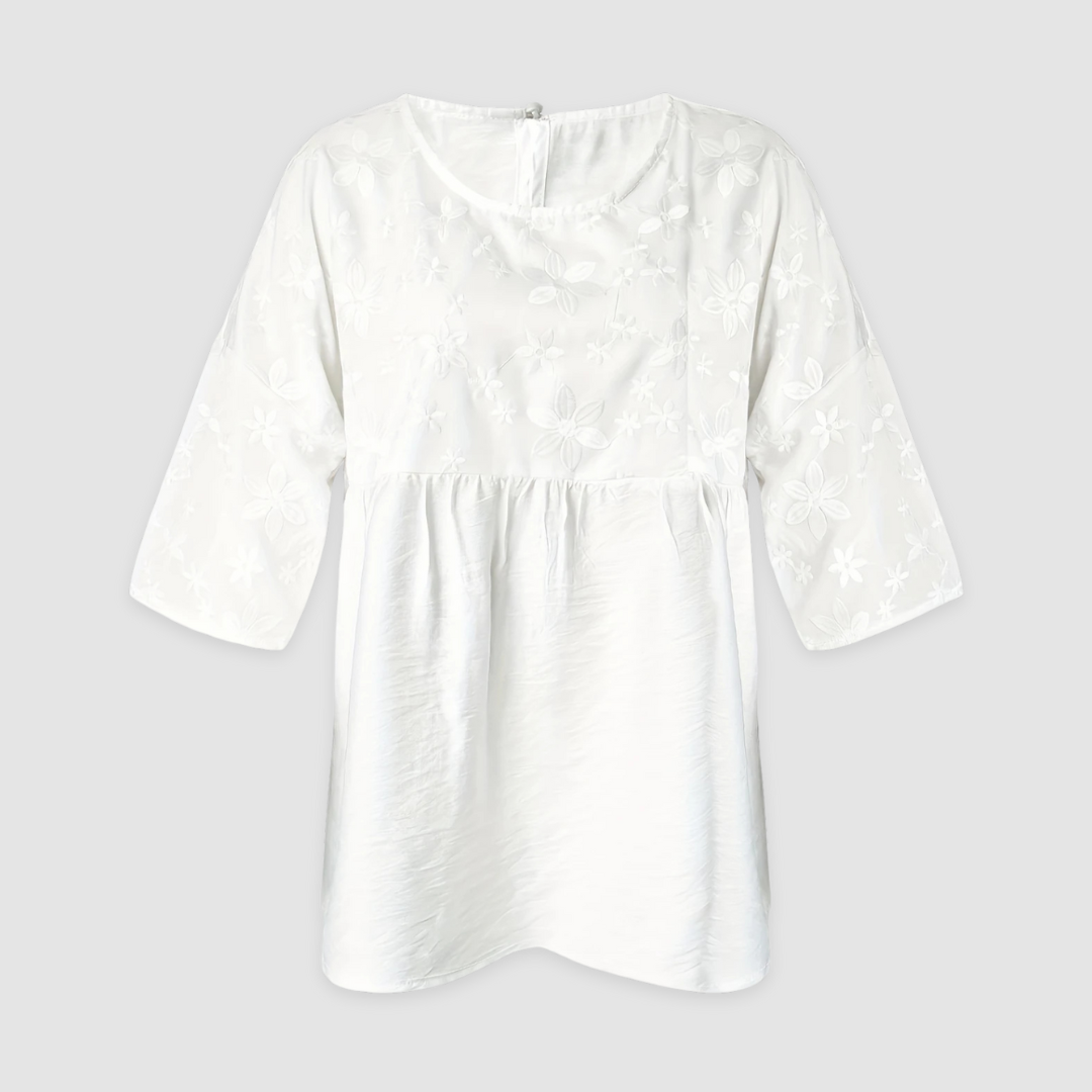 White loose-fit shirt with allover floral pattern and long sleeves