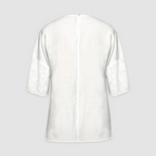 White loose-fit shirt with floral cuffs and buttoned back opening
