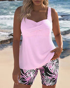 Pink ribbed tankini top with palm-leaf print swim shorts