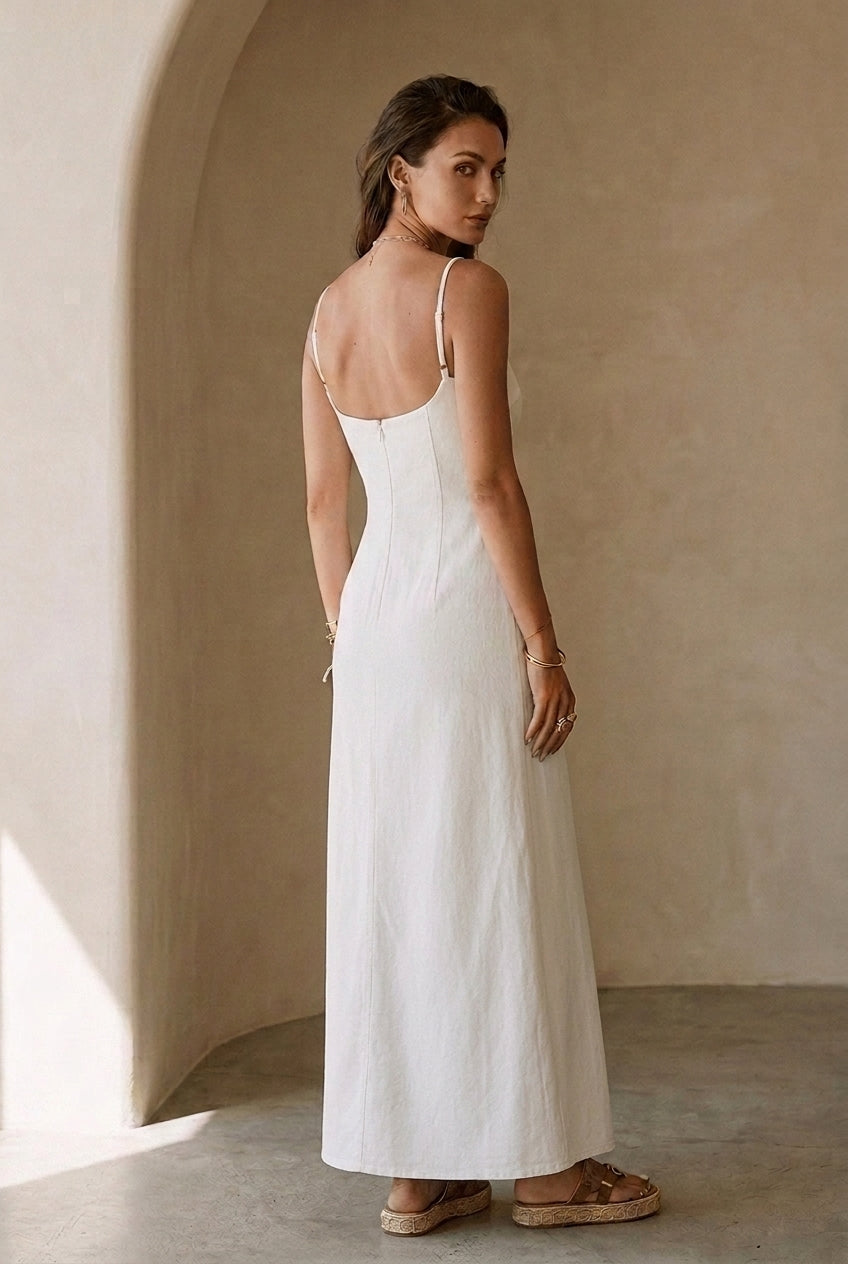 White strappy maxi dress from the back, slim straps and open-back seam details