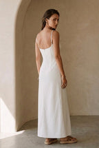 White strappy maxi dress from the back, slim straps and open-back seam details