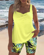 Yellow ribbed tankini top with palm-leaf print swim shorts