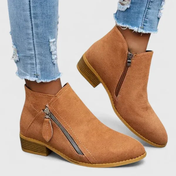 Orange suede orthopedic ankle boots with side zipper and low block heel
