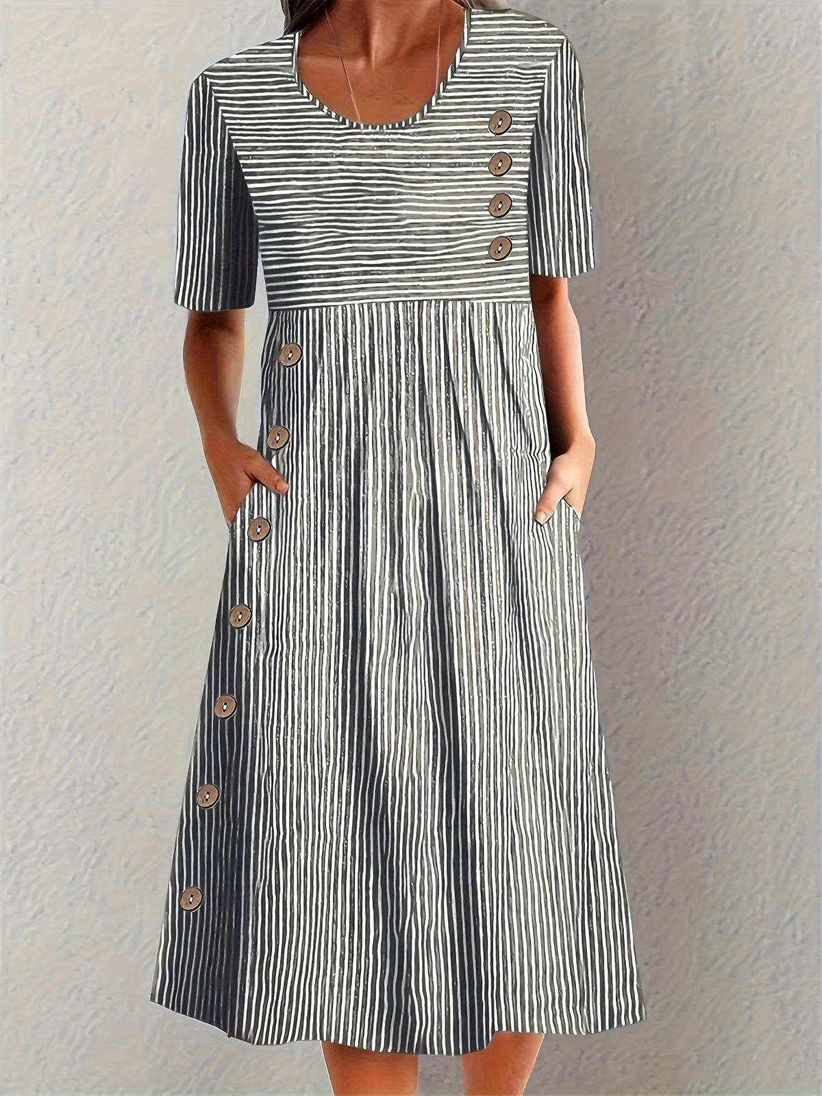 Black and white striped short-sleeve summer dress with button placket and skirt pleats