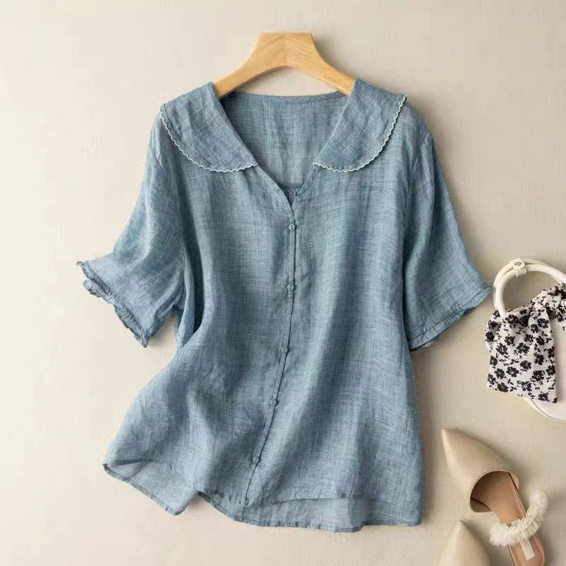 Blue short-sleeve cotton blouse with scalloped peter pan collar and button-front