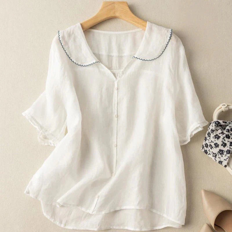 White short-sleeve cotton blouse with scalloped peter pan collar and button-front