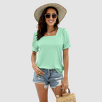 Square-neck blouse in aqua green with puff sleeves and gathered cuffs