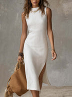 White sleeveless stand-collar midi dress with front slit and split hem