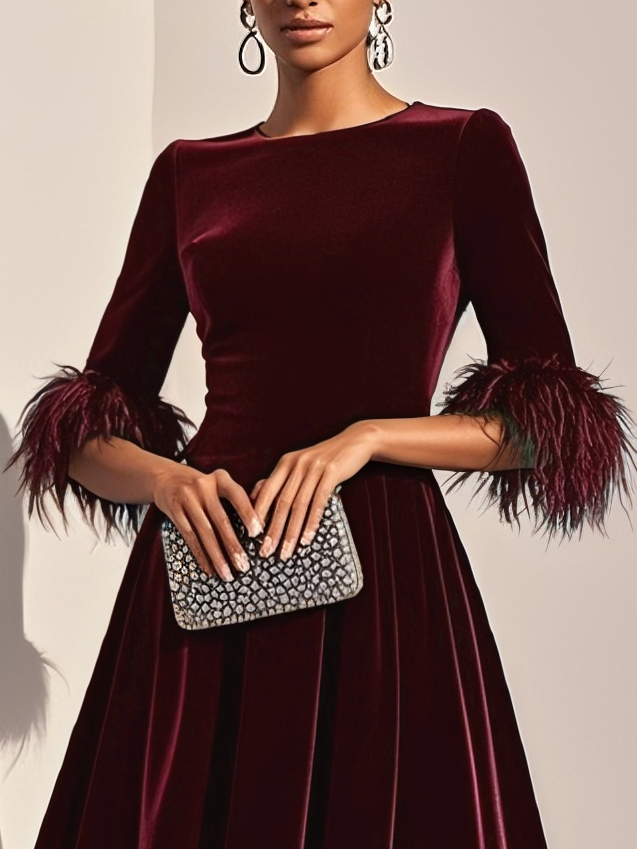 Burgundy velvet midi A-line dress close-up, round neck and feather-trimmed cuffs