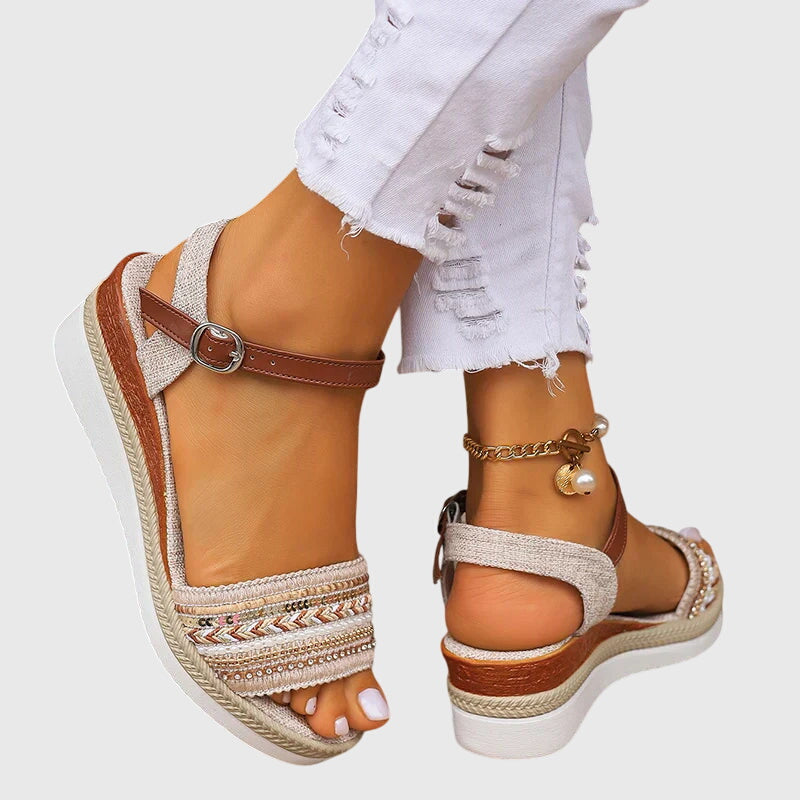 White and brown open-toe wedge sandals with ankle strap and patterned front band