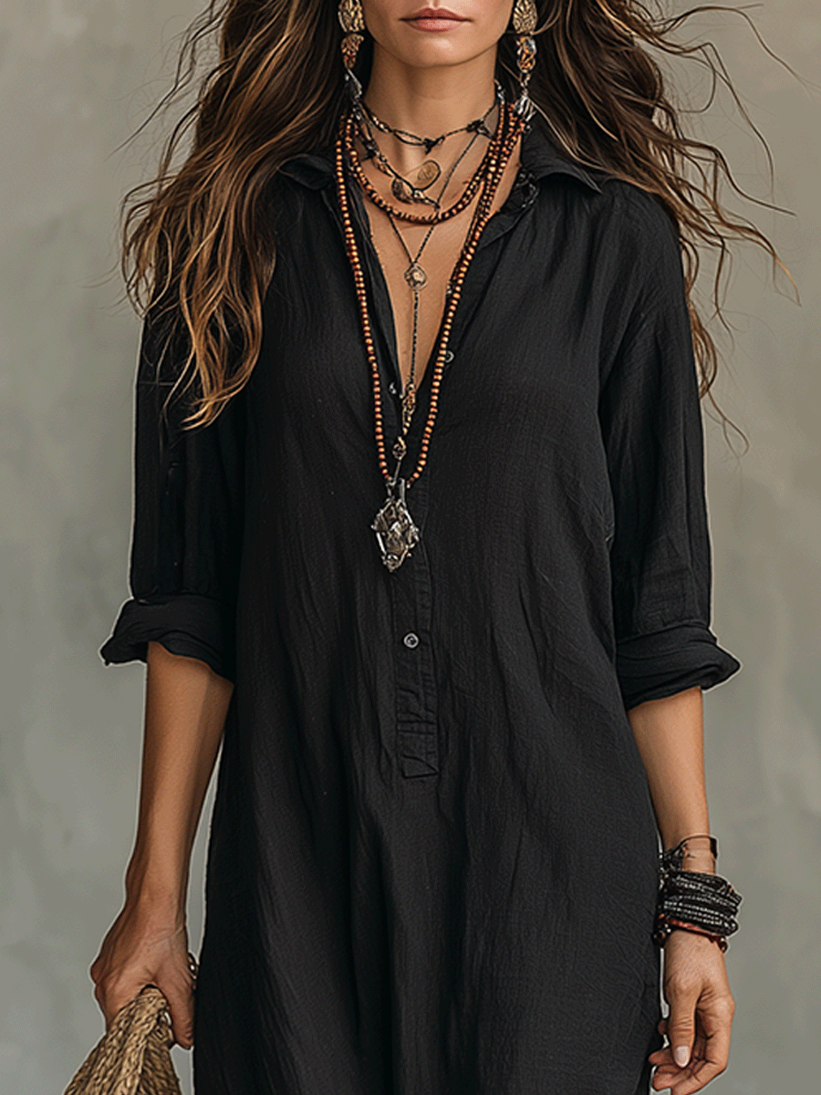 Black button-front shirt maxi dress with deep V neckline and quarter sleeves.