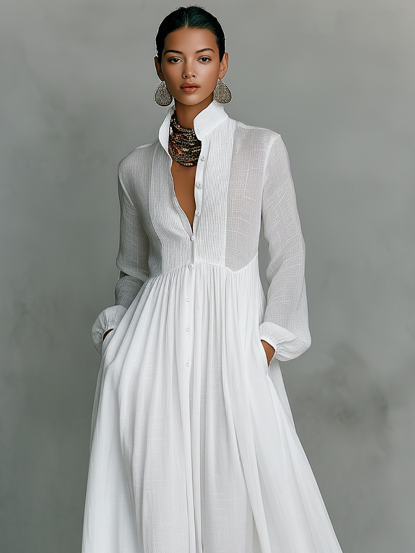 Women's white long-sleeve maxi dress with stand-up collar and gathered patchwork bodice