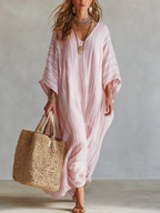 Soft pink striped kaftan dress with V-neck, loose fit, and wide draped sleeves