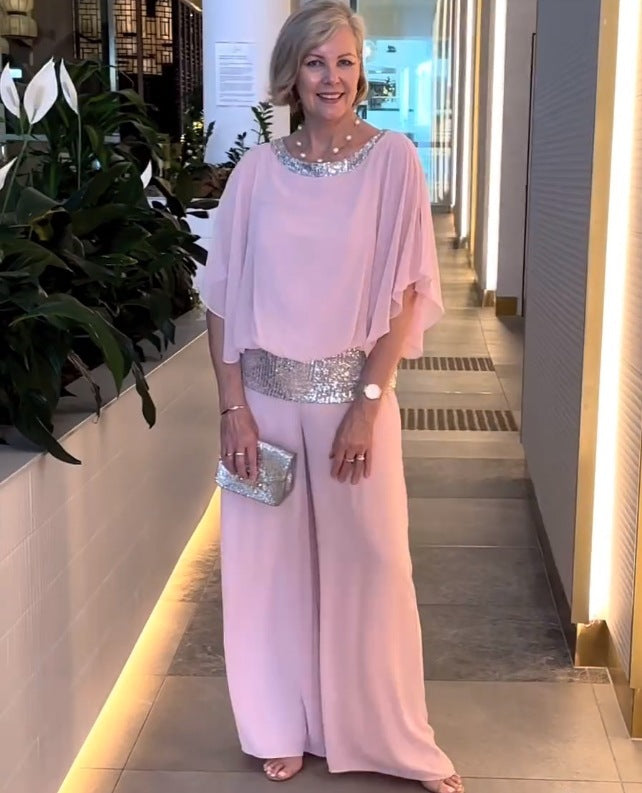 Pink 2-piece set with draped top, wide-leg pants, and jeweled sequin belt