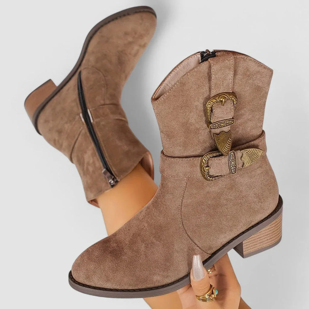 Brown suede orthopedic western boots with decorative side buckle and mid heel.