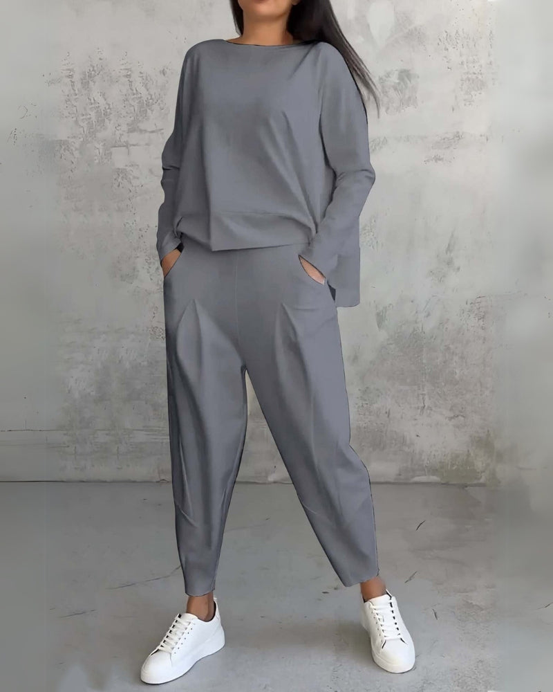 Gray two-piece lounge set, long-sleeve crewneck top and relaxed jogger pants