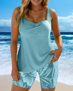 Blue ribbed tankini set with V-neck sleeveless top and leaf-print swim shorts