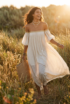 Ivory off-shoulder pleated maxi dress with airy drape and bracelet-length puff sleeves