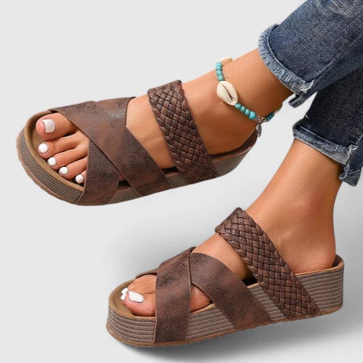 Cognac orthopedic sandals, braided toe strap and wide crossover on a wedge sole