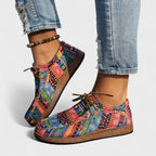 Seryphina™ orthopedic sneakers pair, multicolor patchwork uppers, lace-up front, low profile