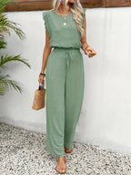 Green sleeveless two-piece set with lace trim and drawstring wide-leg pants.