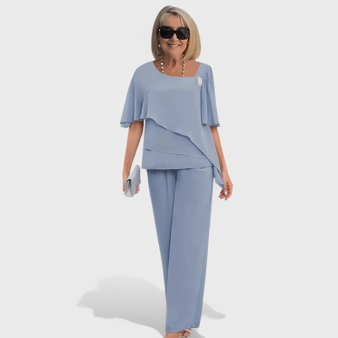 Light blue two-piece set: short-sleeve layered top and matching straight-leg pants