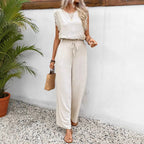 Cream sleeveless two-piece set with ruffle cap sleeves and drawstring wide-leg pants