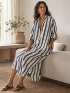 Striped maxi dress in blue and off-white, V-neck, button placket, three-quarter sleeves