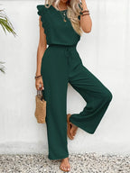 Dark green sleeveless two-piece set with textured ruffle top and wide-leg pants