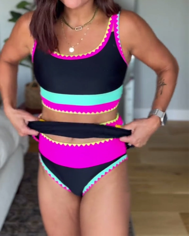 Color-block three-piece swimsuit detail, black with pink and teal horizontal stripes.