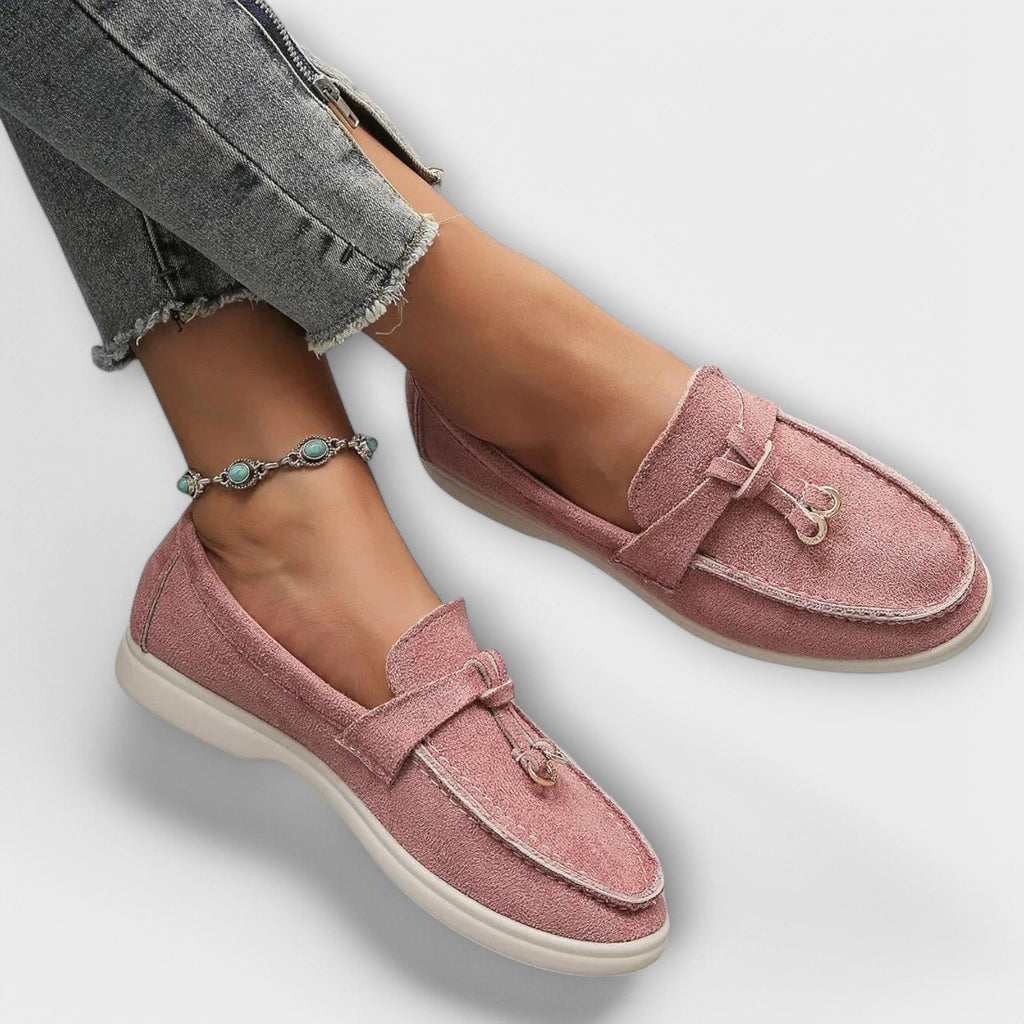 Pink women's suede loafers with tie bow detail and low profile sole