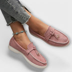 Pink women's suede loafers with tie bow detail and low profile sole