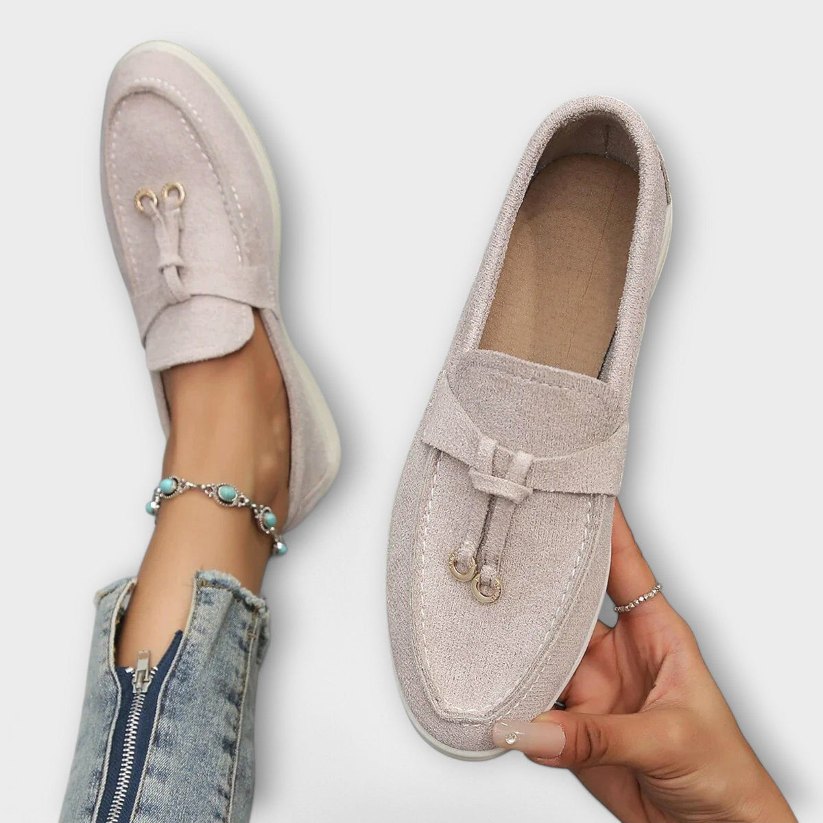 Beige women's suede loafers with tie bow detail and cushioned sole