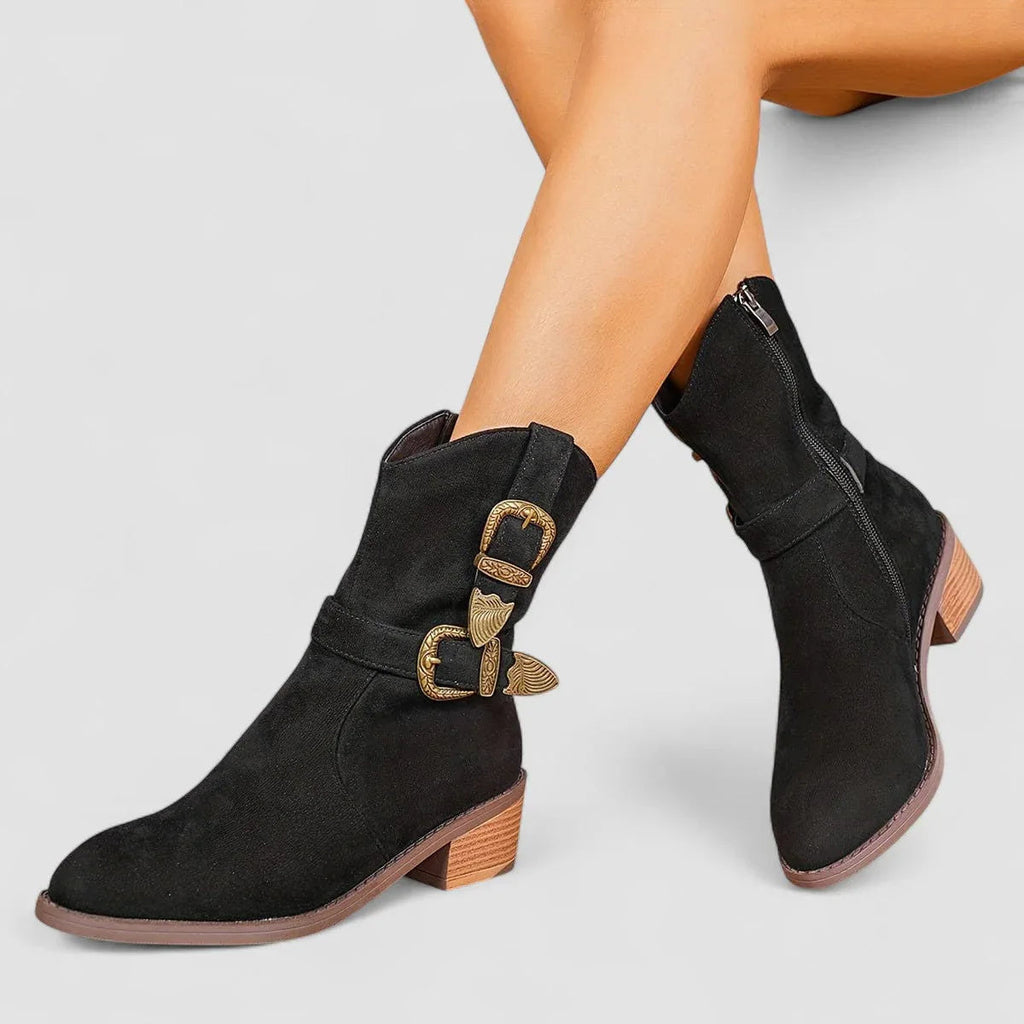 Black suede western boots with gold decorative side buckle and block heel.