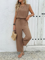 Taupe two-piece set with lace-trim sleeveless top and tied wide-leg pants.