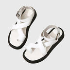 White orthopedic sandals with cross straps and adjustable ankle buckle