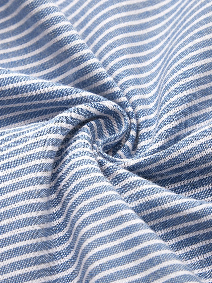 Blue and white striped fabric close-up with soft drape
