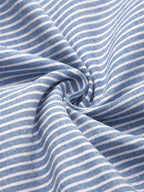 Blue and white striped fabric close-up with soft drape