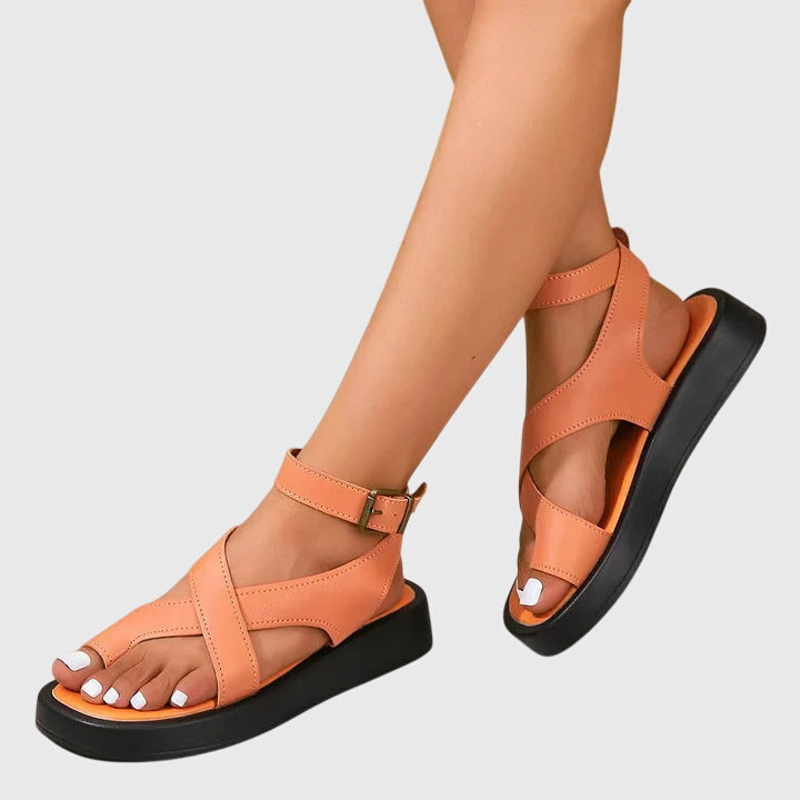 Orange orthopedic sandals with two adjustable straps and open toe