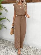 Taupe sleeveless top and matching drawstring wide-leg pants, front view.