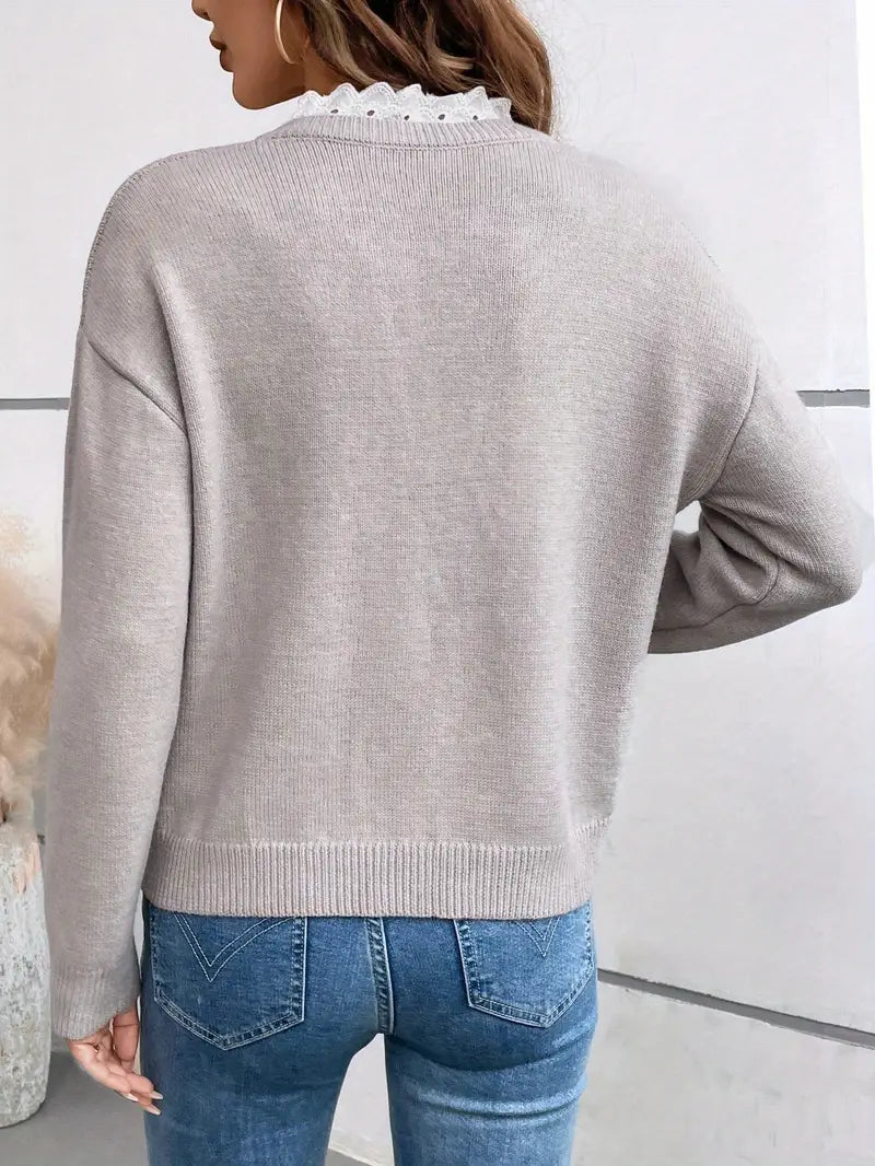 Kaitlyssa gray sweater back view with ribbed hem and long sleeves