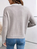 Kaitlyssa gray sweater back view with ribbed hem and long sleeves