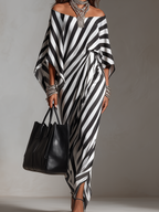 Black-and-white striped off-shoulder maxi dress with asymmetric hem and flowing drape