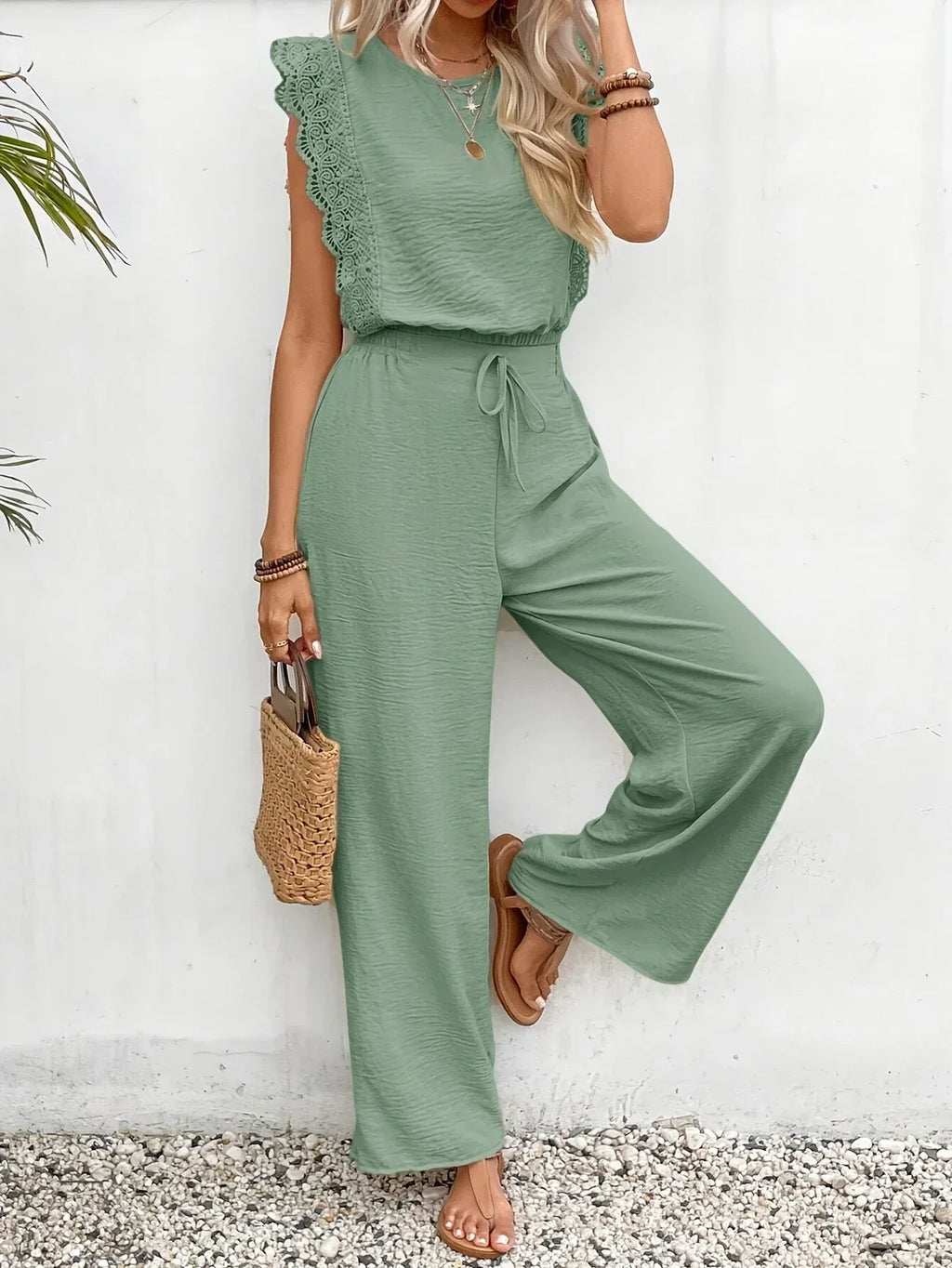 Emerald green sleeveless top and wide-leg pants set with lace trim, drawstring waist